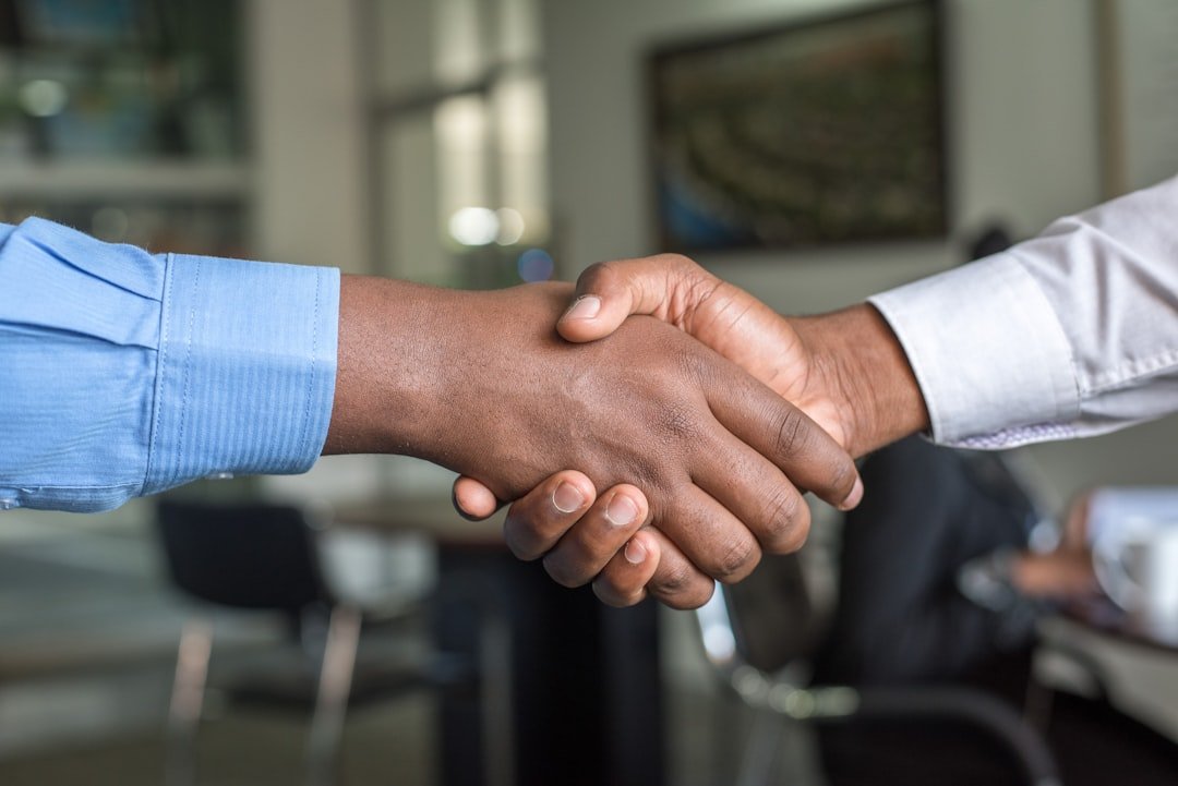 Handshake between property manager and provider representing Saint Paul Apartment Turnover coordination
