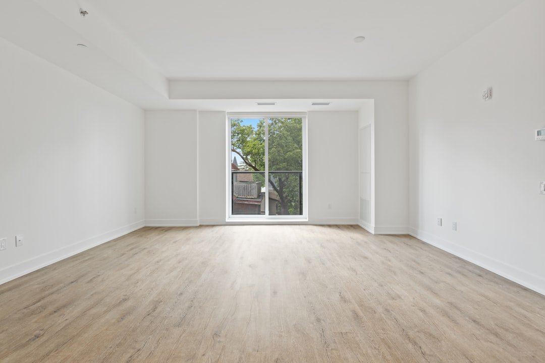 Hardwood flooring in an empty apartment unit ready for a flooring turnover in Saint Paul, MN