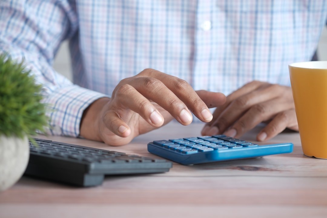 Calculator and paperwork representing apartment turnover cost planning in Saint Paul, MN